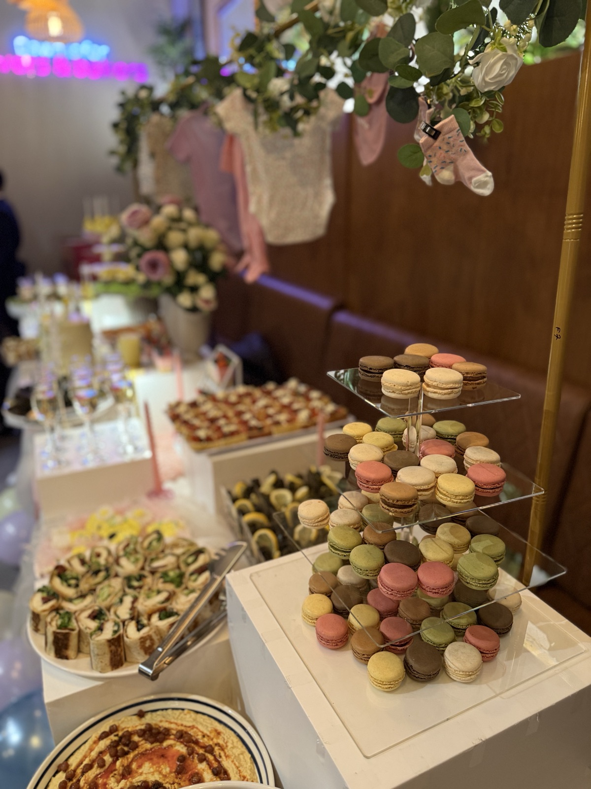 Event table with a macaron tower and savoury wraps