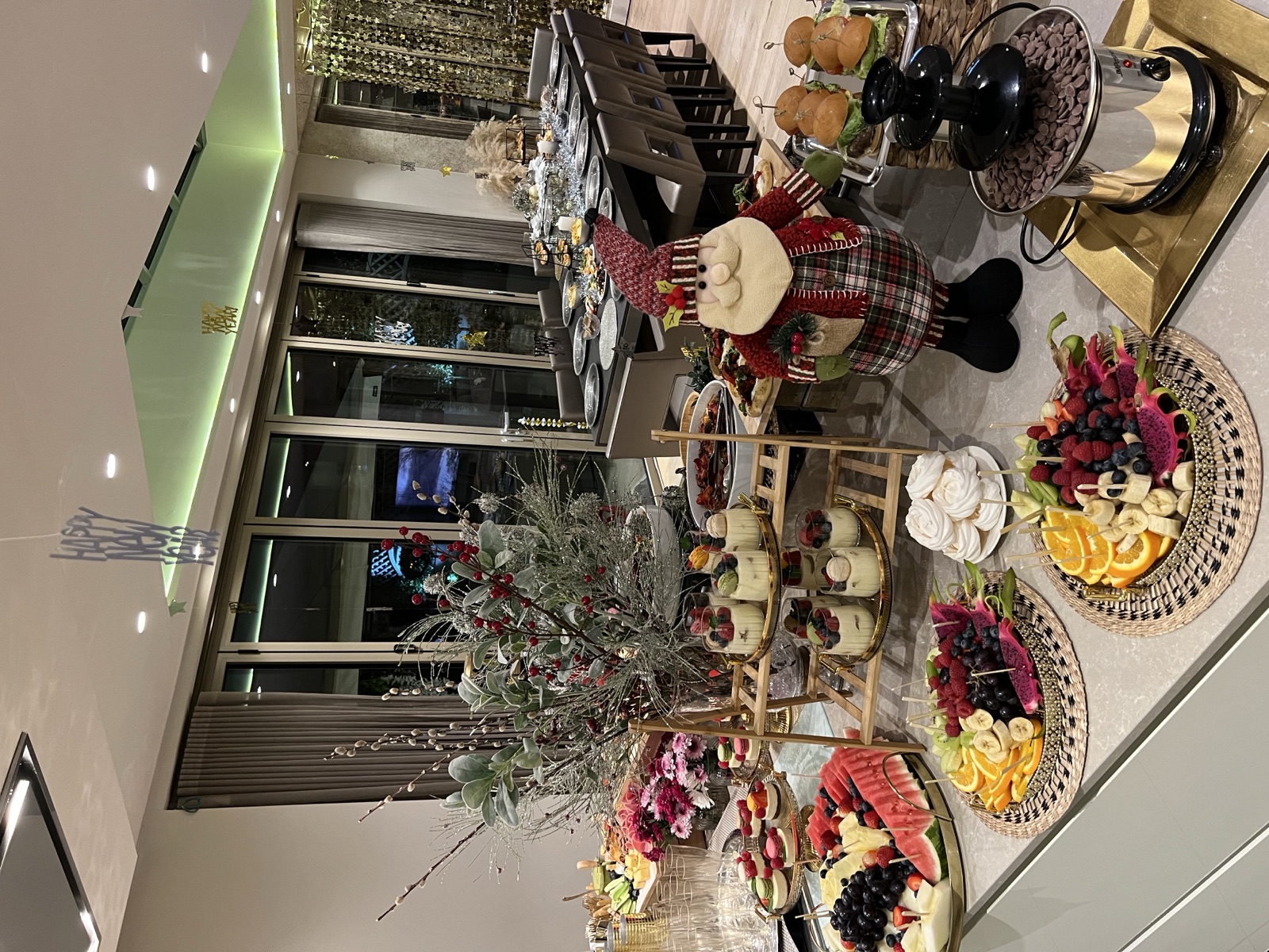 Christmas party table with fruit platters and festive styling